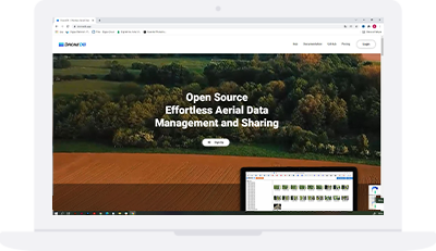 Laptop showing the DroneDB home page: “Effortless Aerial Data Management and Sharing”