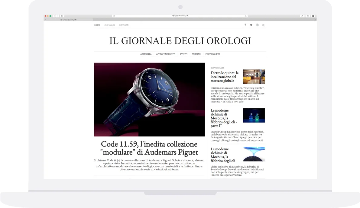Laptop showing the Il Giornale degli Orologi home page with a featured article on a watch