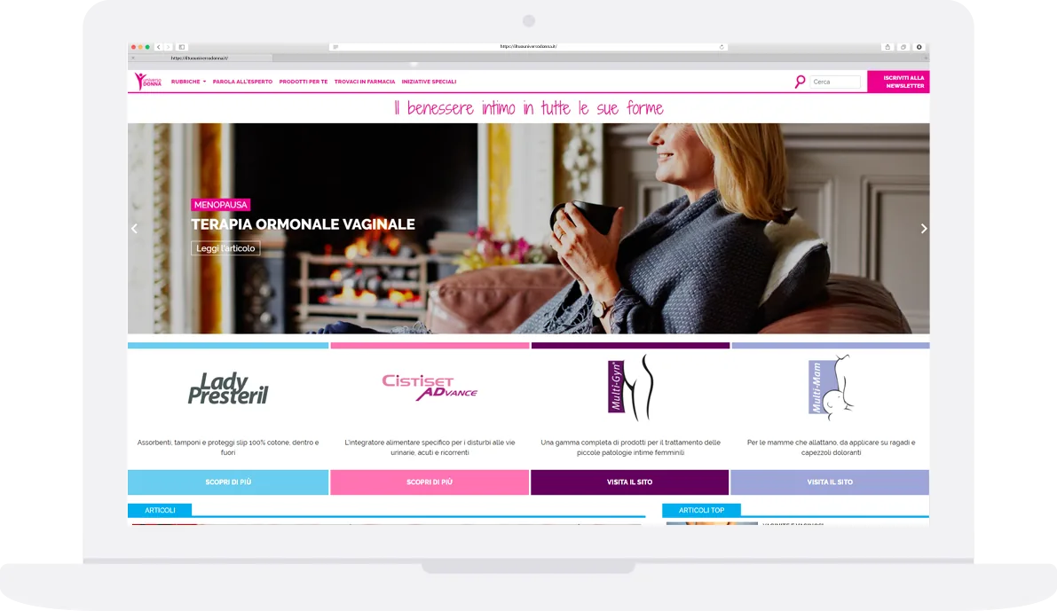Laptop showing the Il Tuo Universo Donna home page with the four colour-coded product sections