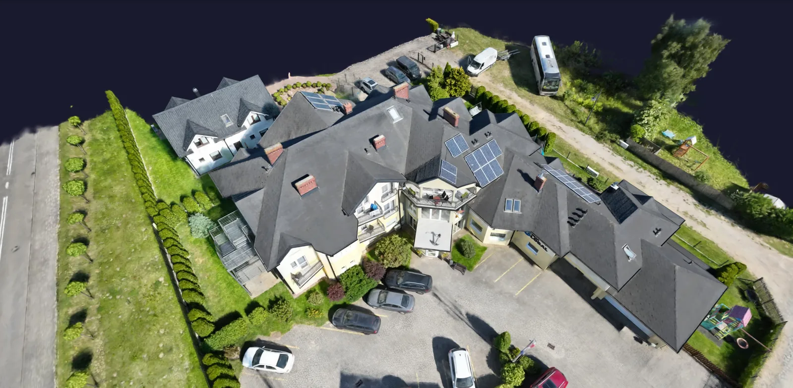 Gaussian splat 3D reconstruction of a building seen from above, viewed in DroneDB